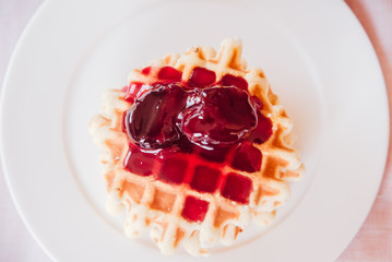 Belgian waffle with plum jam