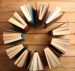 Heart of books, on wooden background