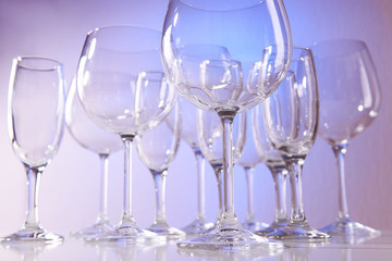 Empty wine glasses on blue background
