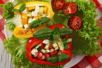 Fresh green salad in pepper on table close up