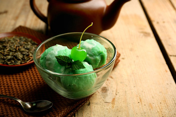 Homemade Green tea ice-cream on dark wooden background