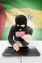 Hacker with flag on background holding ID card in hand - São Tomé and Príncipe