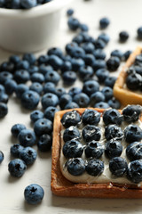 Gourmet fresh blueberry tarts on table