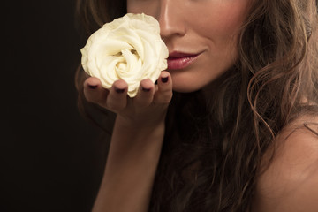 Beautiful fashion model with white rose