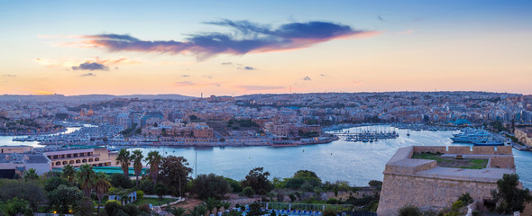 Panoramic view of Malta with the walls of Valletta at dusk - Malta