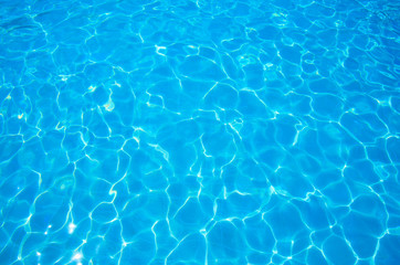 Naklejka na ściany i meble Blue ripped water in swimming pool