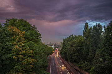 Skyline of central London with storm clouds from Holloway Bridge, UK