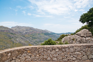 Drystone wall with mountain scenery on a sunny summer day in Mallorca, Balearic islands, Spain.