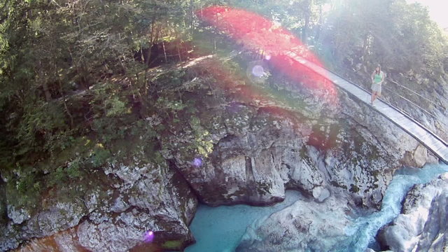 AERIAL: Flying over the bridge on river Soca