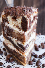  Marble cake with coffee beans, sprinkled with chocolate shavings.selective focus