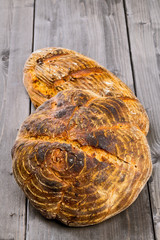 Hand made bread loaves on wooden table