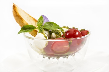 tomatoes and cheese on white plate in a restaurant