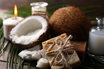 Spa coconut products on dark wooden background