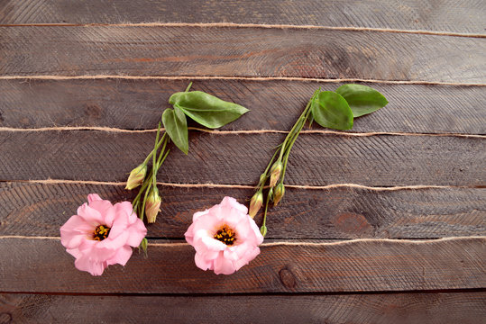 Creative music notes made of flowers on wooden background