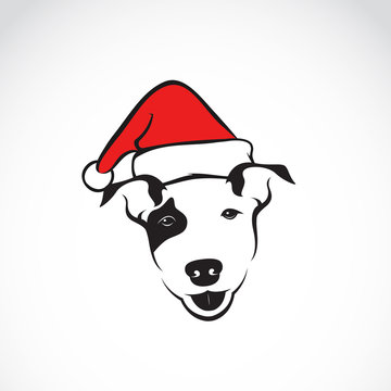 Vector image of an dog and santa hats on white background.
