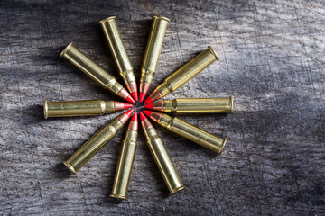 Macro shot of small-caliber tracer rounds with a red tip