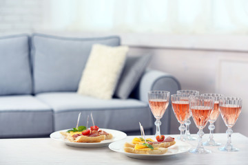 Table at home with food and drinks for friends