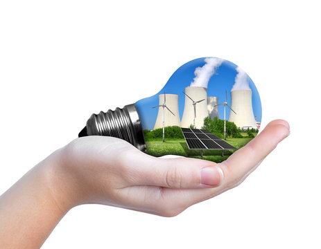 Hand holding eco lightbulb isolated on white background. Energy resources concept.