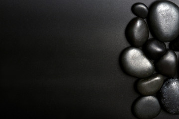 Spa stones on black background