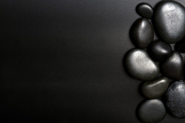 Fototapeta premium Spa stones on black background