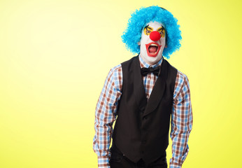 Fototapeta na wymiar portrait of a funny clown over white