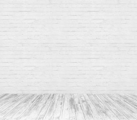 white room interior with brick wall and wood floor 
