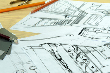 Drawings, sketches, pencils, stationery on the table.