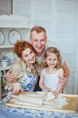 Portrait a happy family on a kitchen. Their noses is dirty