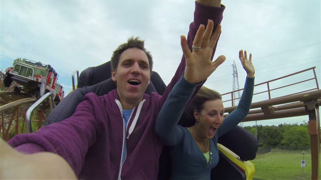 Young Couple On A Rollercoaster