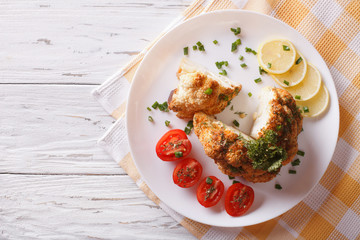 baked cauliflower and fresh tomatoes. Horizontal top view
