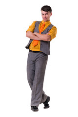 Full length of a handsome business man with hands folded against white