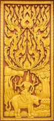 Fototapeta na wymiar Thai wooden statues on the Thai church's window