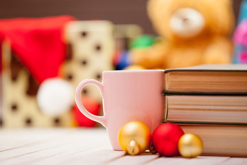 Cup of coffee or tea with books
