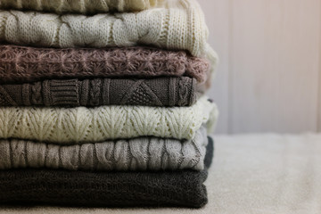 stack of sweaters knitted autumn concept