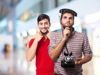 young man thinking telephone