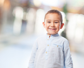 portrait of a little boy with smiling gesture