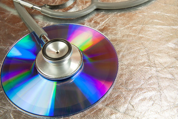 Disk CD and stethoscope