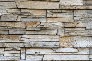 Stone masonry wall of stone blocks.