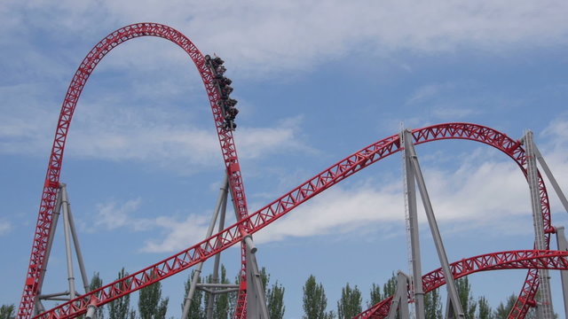 SLOW MOTION: People riding the roller coaster