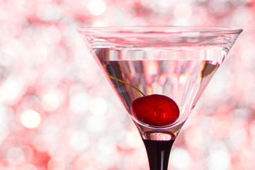 Cocktail in martini glass on the bokeh background