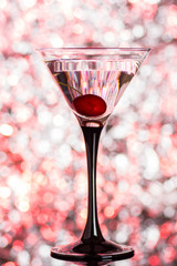 Cocktail in martini glass on the bokeh background