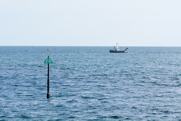 Trawler boat heading out to sea from Teignmouth, Devon, England