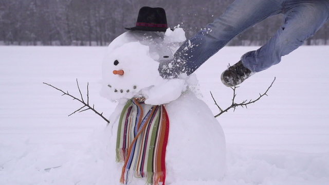 Man crushing a snowman