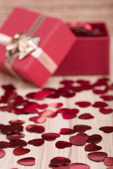 Red hearts confetti on wooden background
