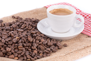 Cup of coffee with coffee beans