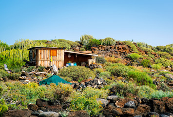 Fototapeta premium Self-made hovel in a tropics. Photo taken in Tenerife coast