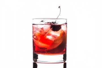 Old fashioned cocktail on white wooden background