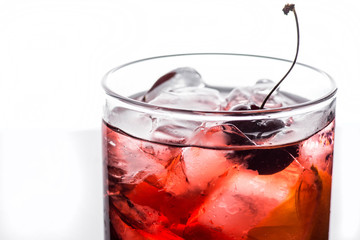 Old fashioned cocktail on white wooden background