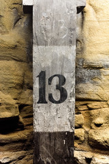 Number 13 on wooden post