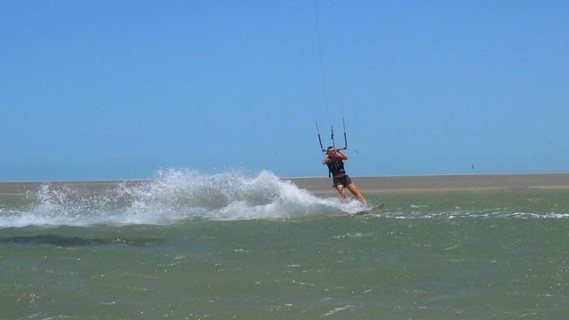 Female kiteboarder jumping